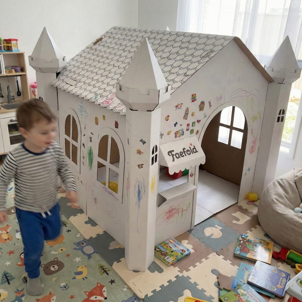 Child playing with a cardboard playhouse in a room with a child's play area.
